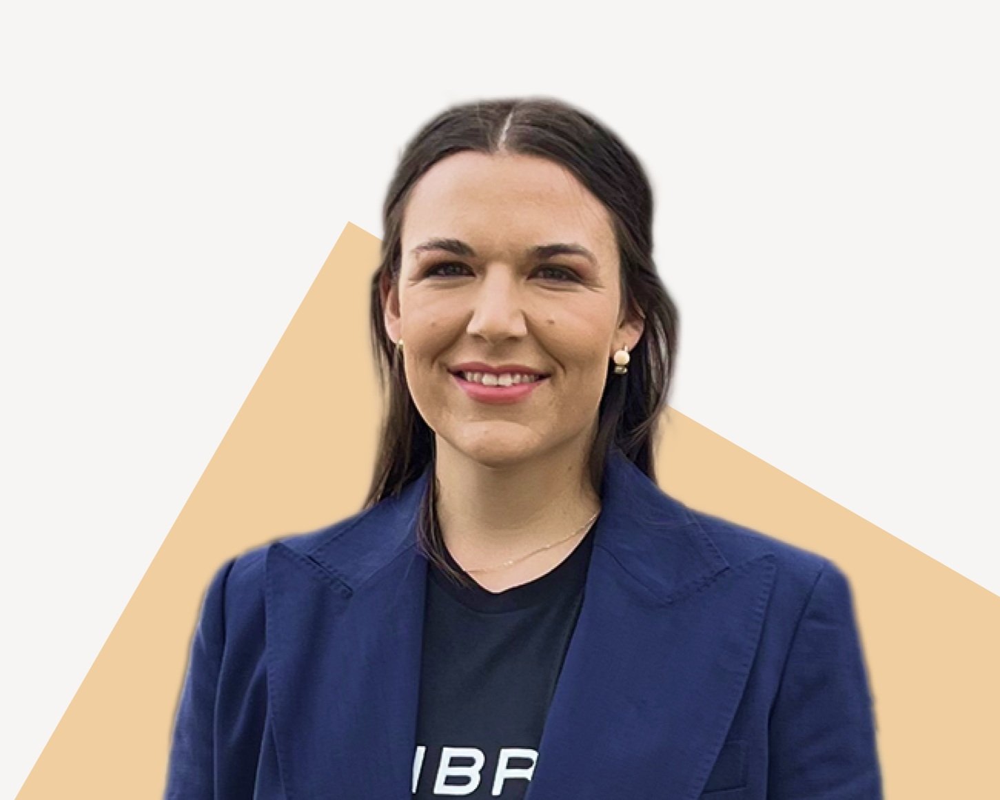 LP Peterson, Senior Technical Program Manager at Sibros, smiling in blue coat.