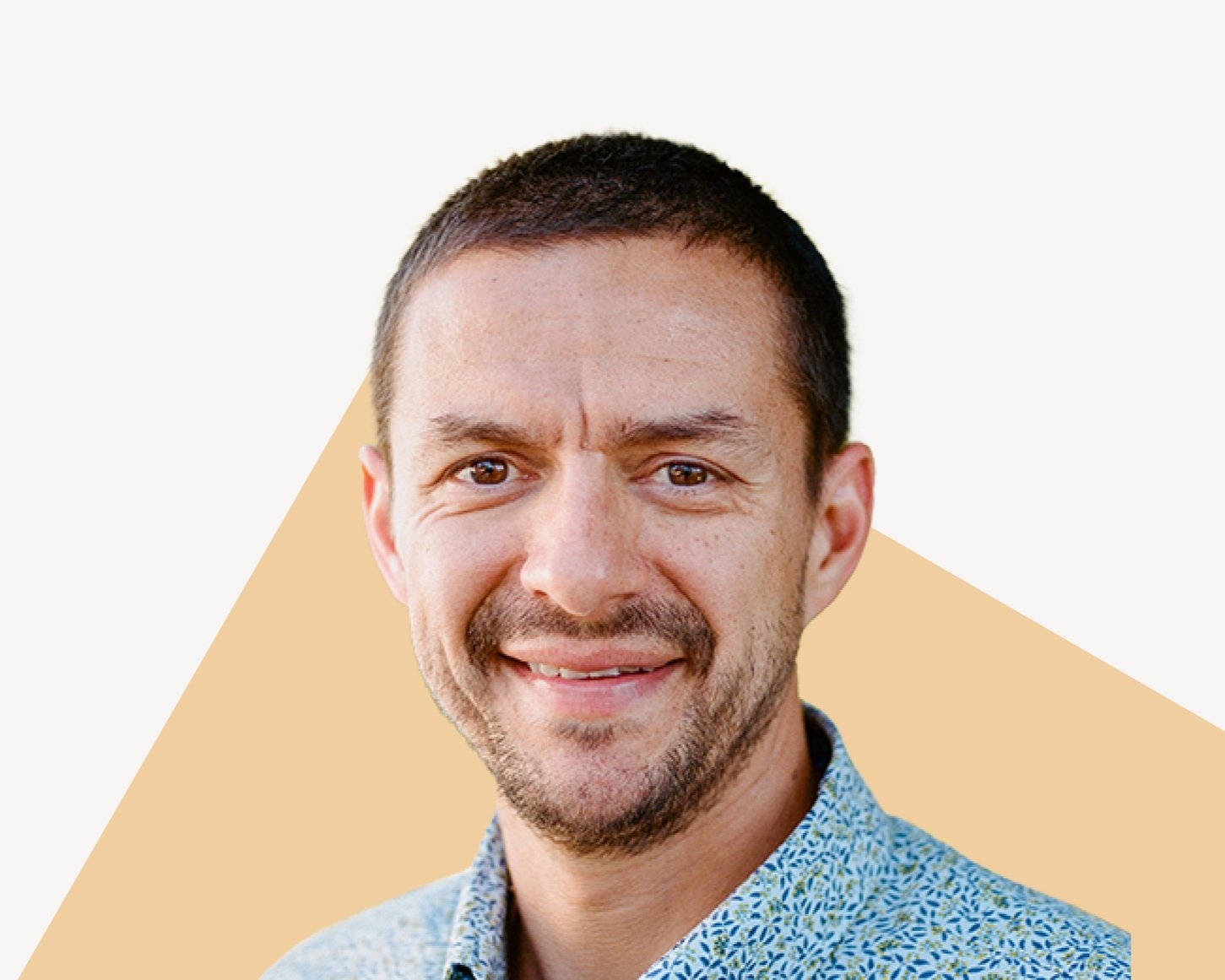 Max Shevyakov, CEO of BorrowLenses (acquired by Shutterfly), smiling in collared shirt.